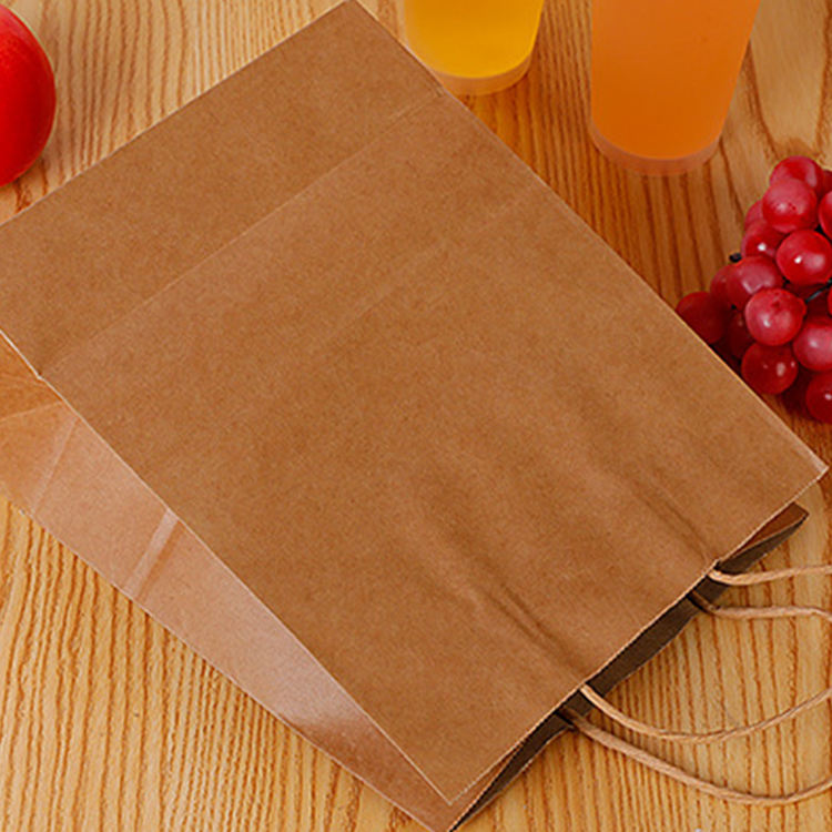 Healthy platter takeaway divided chicken pieces and French fries packed lunch box double kraft paper food packaging