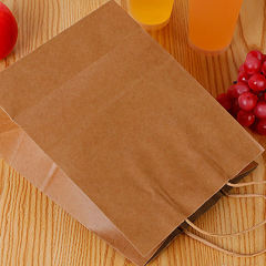 Healthy platter takeaway divided chicken pieces and French fries packed lunch box double kraft paper food packaging