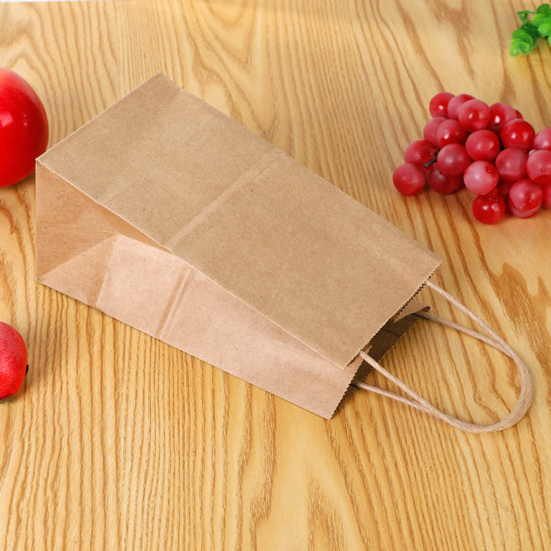 Healthy platter takeaway divided chicken pieces and French fries packed lunch box double kraft paper food packaging