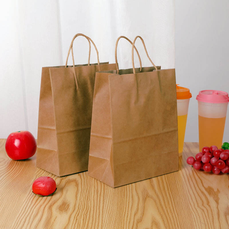 Healthy platter takeaway divided chicken pieces and French fries packed lunch box double kraft paper food packaging