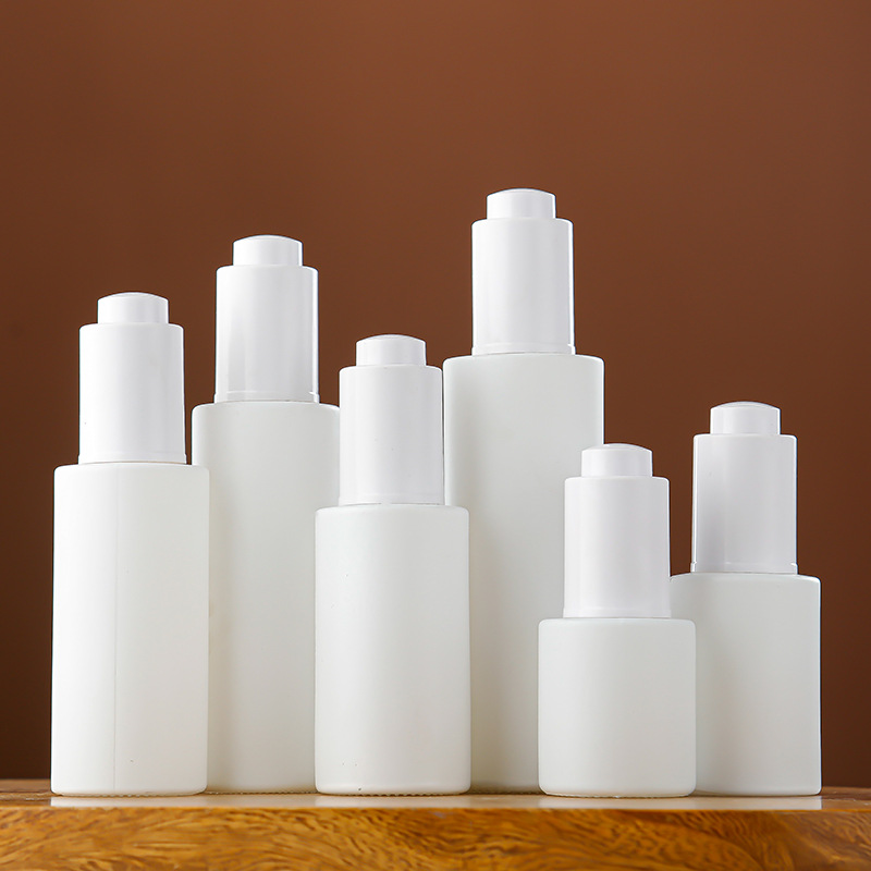 White glass flat shoulder essential oil bottle push dropper essence bottle multi-specification portable cosmetics empty bottle wholesale