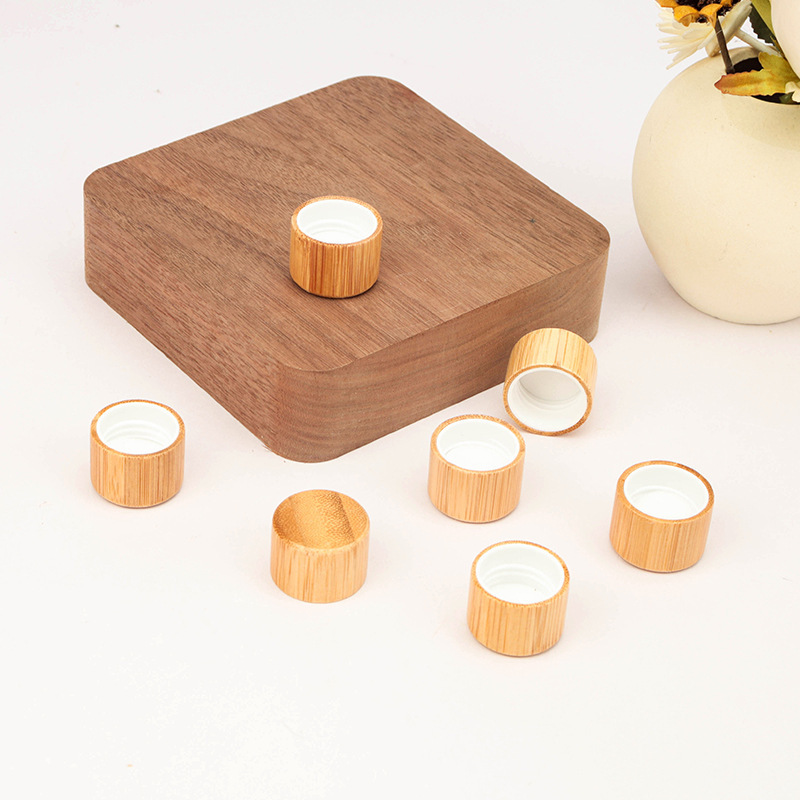 Manufacturers wholesale wood grain cover l frosted transparent ball bottle cover glass bottle bamboo cover ball bottle 5ml essential oil bottle cover