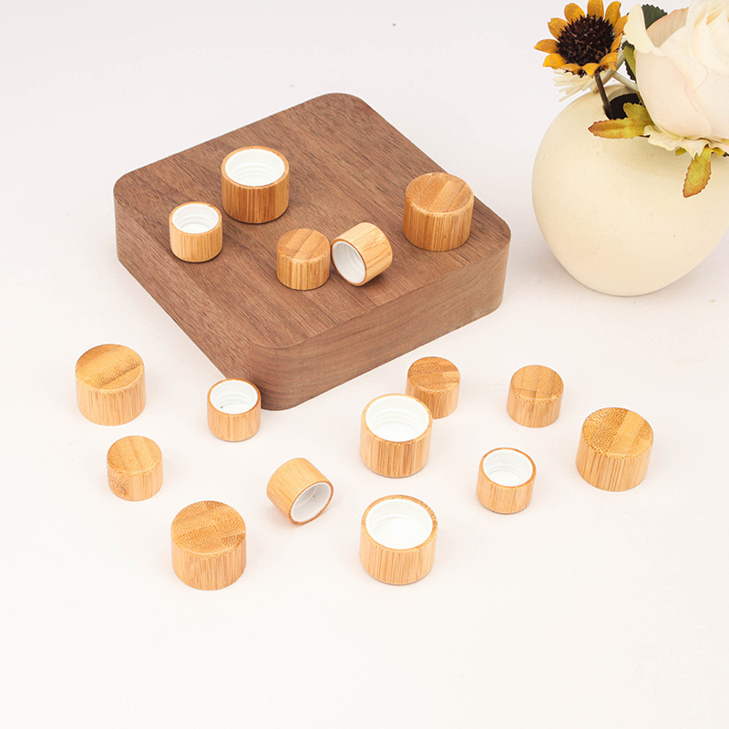 Manufacturers wholesale wood grain cover l frosted transparent ball bottle cover glass bottle bamboo cover ball bottle 5ml essential oil bottle cover
