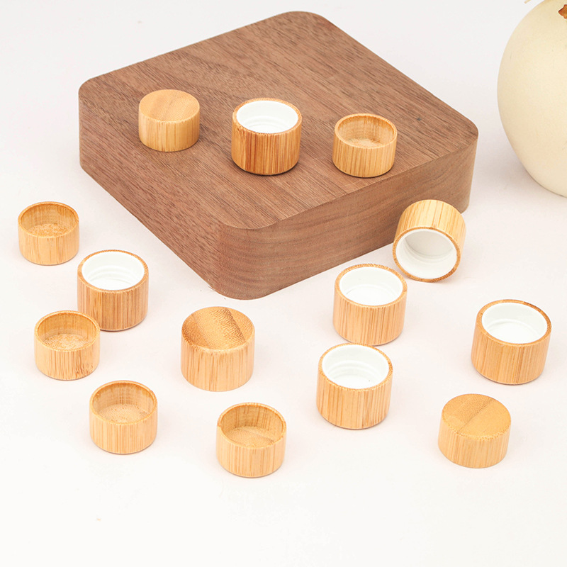 Manufacturers wholesale wood grain cover l frosted transparent ball bottle cover glass bottle bamboo cover ball bottle 5ml essential oil bottle cover