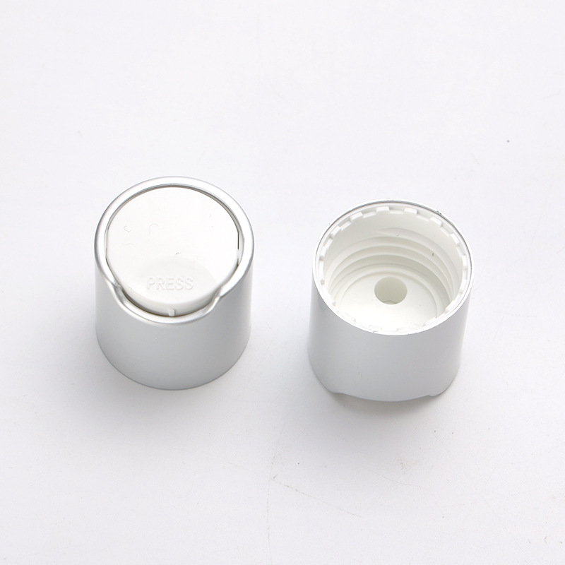 Supply 24MM anodized aluminum Qianqiu cover PP plastic silver glossy press cover lotion bottle cap factory wholesale