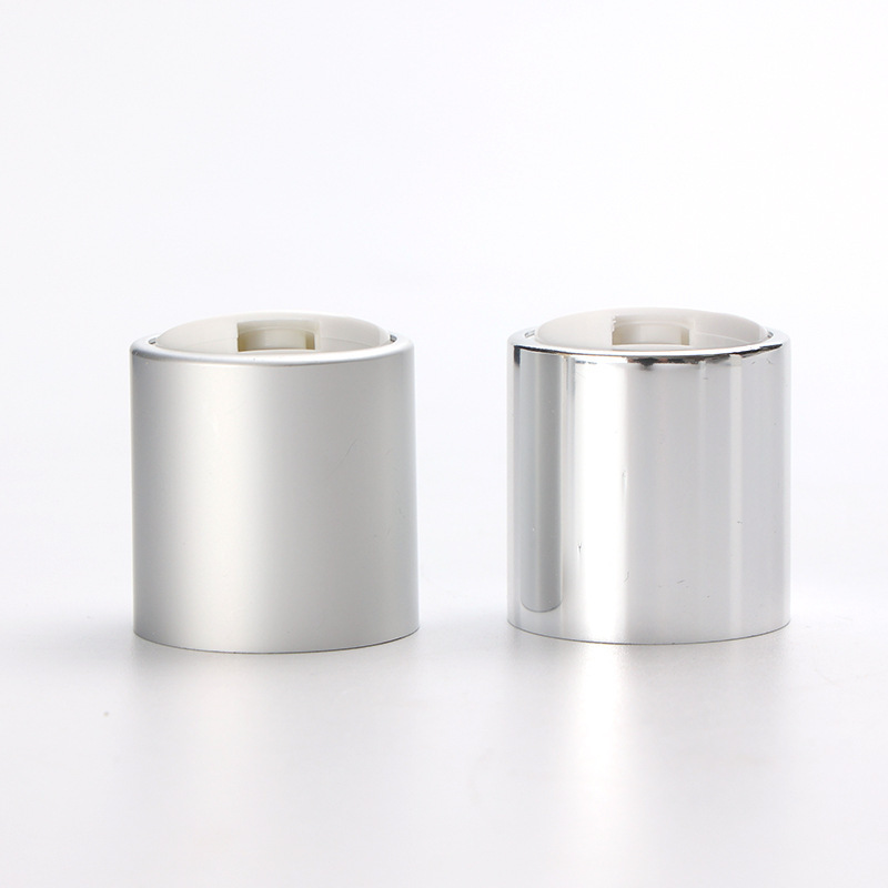 Supply 24MM anodized aluminum Qianqiu cover PP plastic silver glossy press cover lotion bottle cap factory wholesale