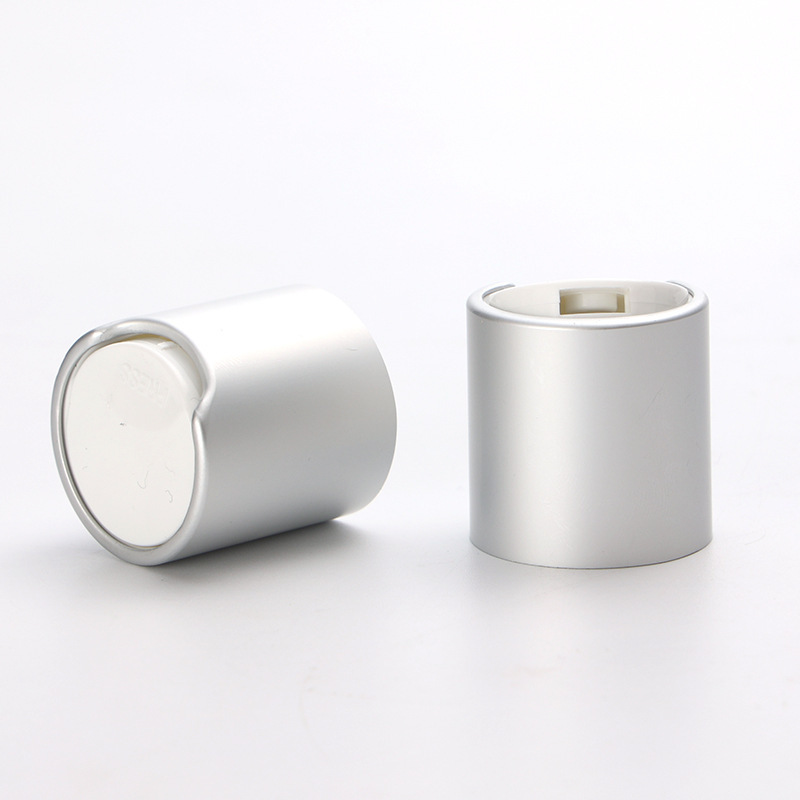 Supply 24MM anodized aluminum Qianqiu cover PP plastic silver glossy press cover lotion bottle cap factory wholesale