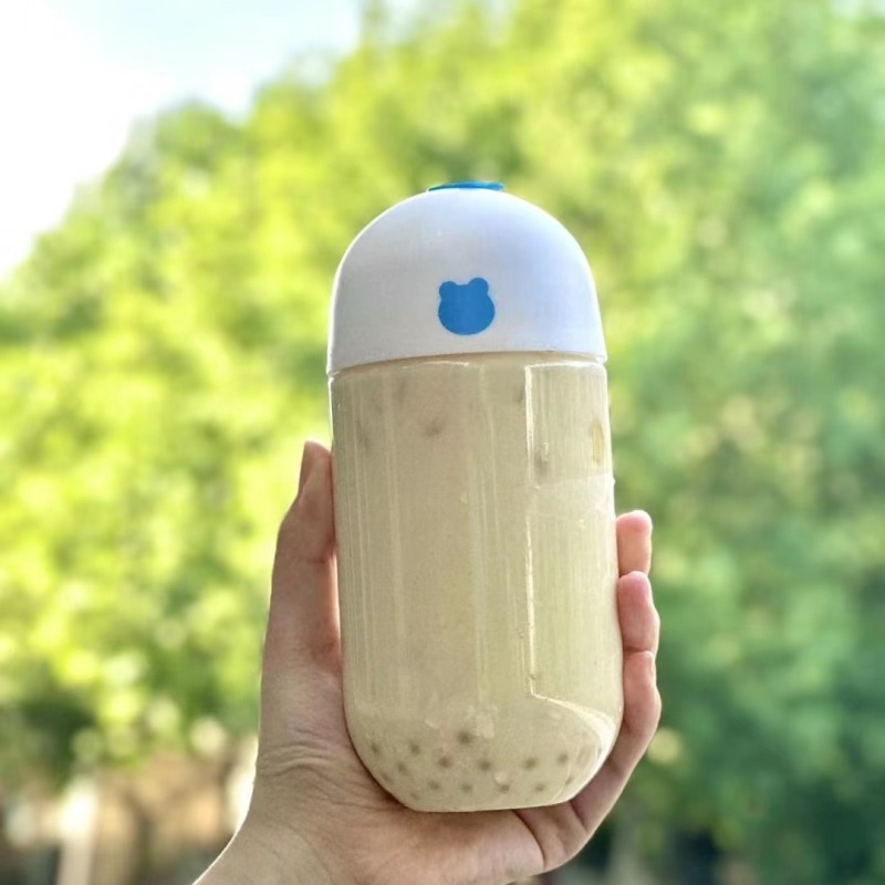 Disposable 500ml capsule bottle transparent milk tea pet take-away beverage with lid internet celebrity U-shaped plastic bottle factory