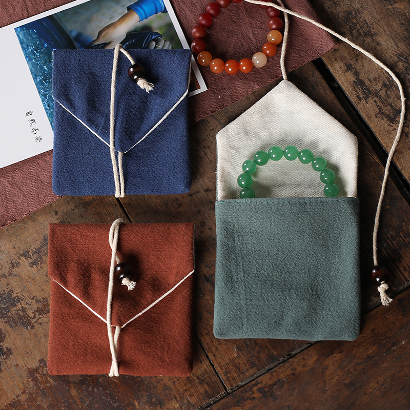 Cotton and linen jewelry bags, triangular bags, brocade pouches, small cloth bags, jewelry packaging bags, rope bags, logo-printed bags, wholesale available.