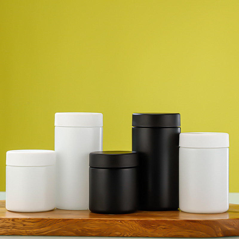 White Black Straight-Sided Round Glass Jars with Child Resistant Caps