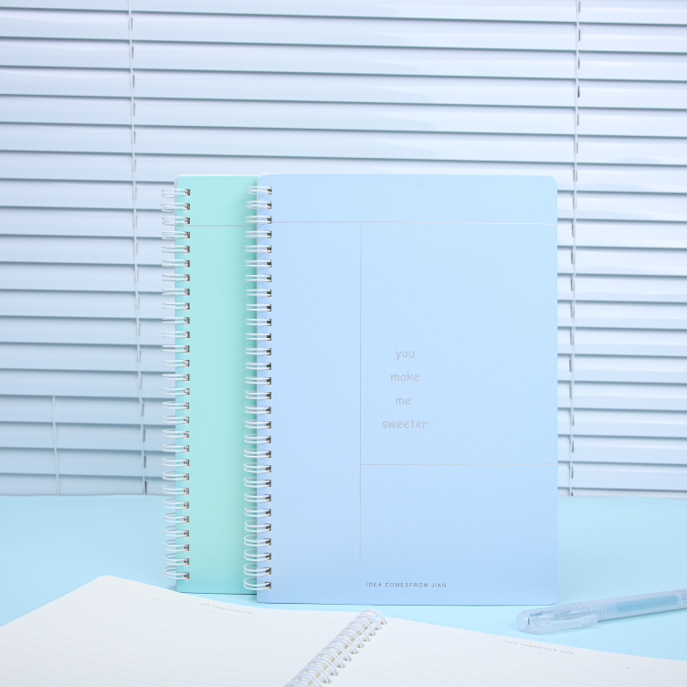 Sprial bound notebook with foil printing on white card cover