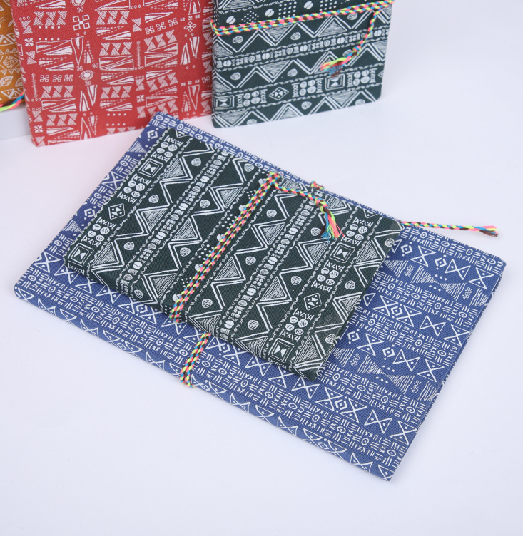 Fabric softcover notebook with string closure