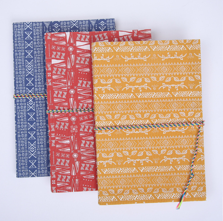 Fabric softcover notebook with string closure