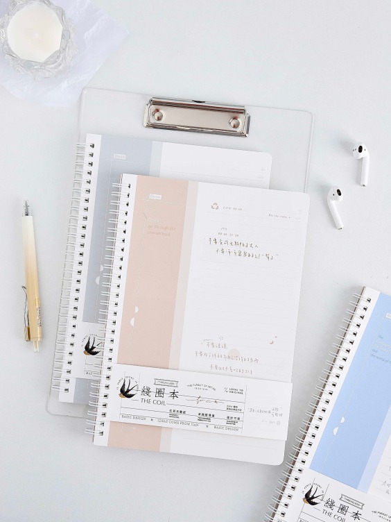 Sprial bound notebook with foil printing on white card cover
