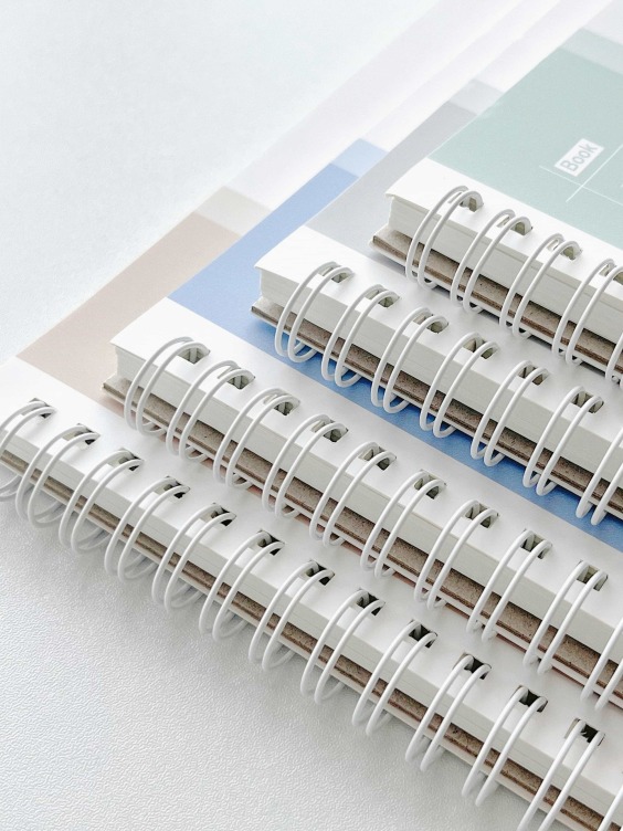 Sprial bound notebook with foil printing on white card cover