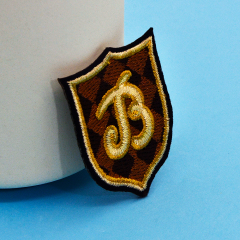 Embroidered pins, custom produced pins in a variety of sizes and shapes,free design