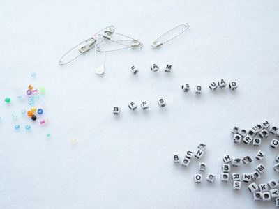 Text and typography are based on enamel pins
