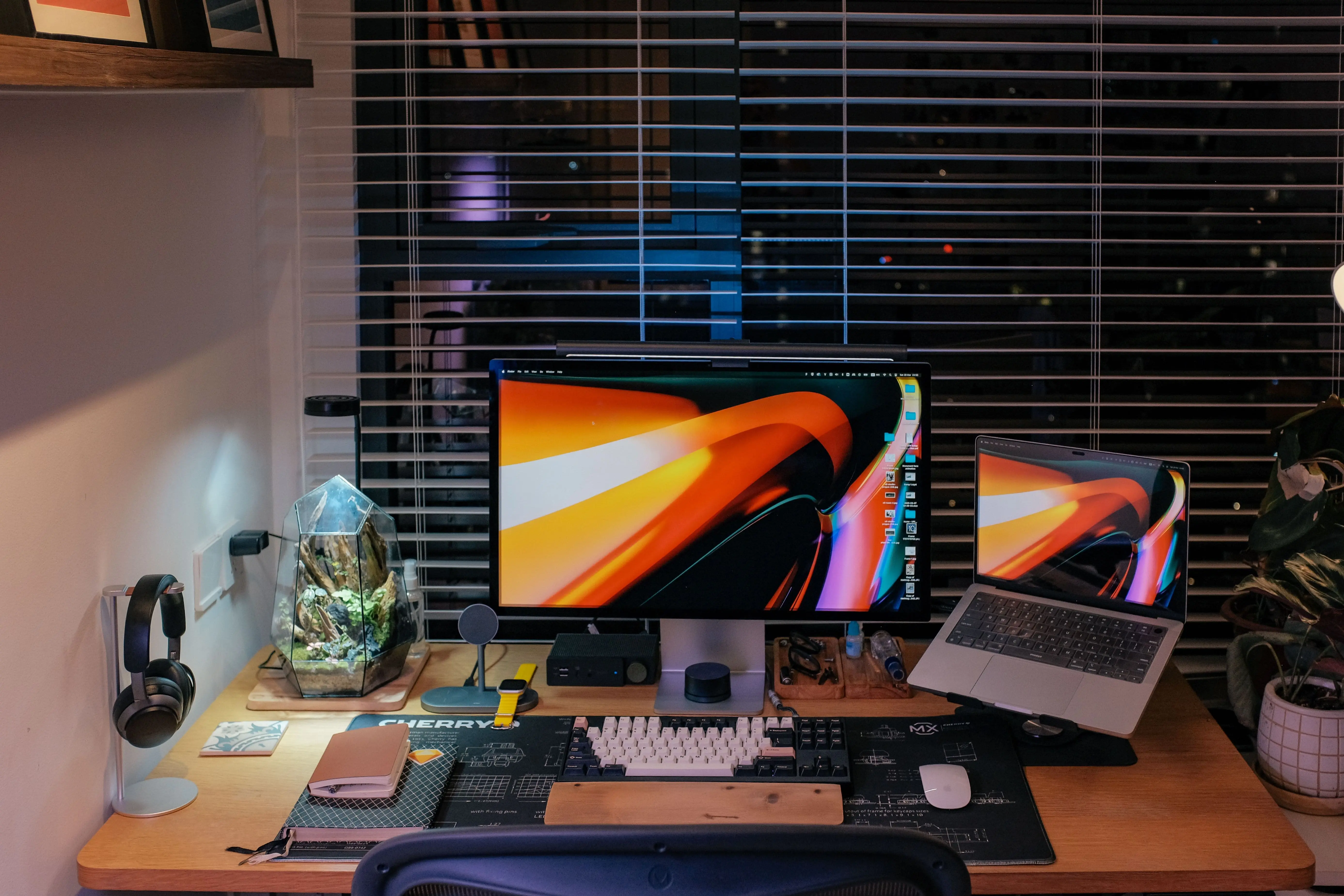 On the bright office desk are placed tools such as the laptop computer monitor.
