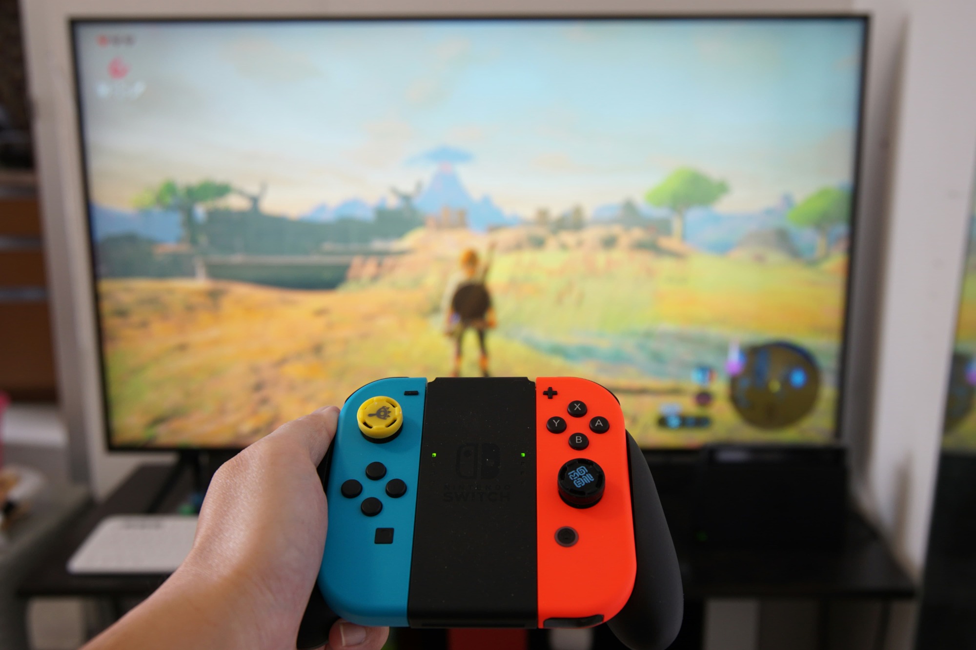 A Switch game controller, playing The Legend of Zelda: Breath of the Wild