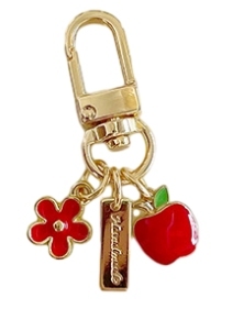 Apple keychain with red flower nameplate