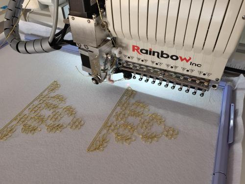 Rainbow embroidery machine with cording embroidery device: cording embroidery