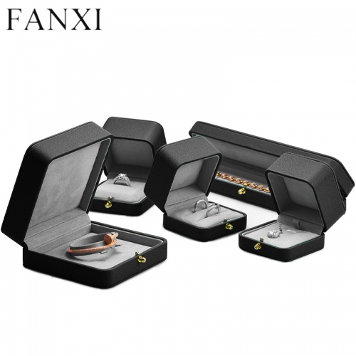 Octagon black leather jewelry packaging box with gray microfiber inside.