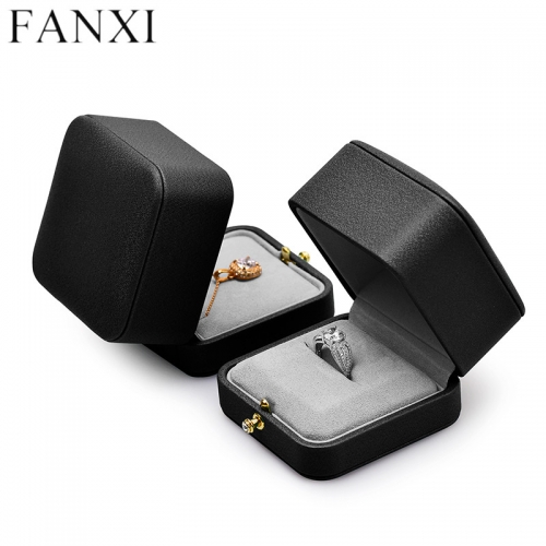 Octagon black leather jewelry packaging box with gray microfiber inside.