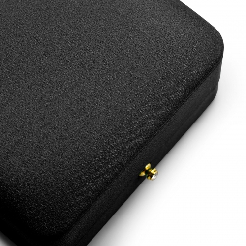 Octagon black leather jewelry packaging box with gray microfiber inside.