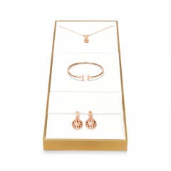 Luxury metal frame jewelry display set with white leather