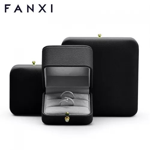 Octagon black leather jewelry packaging box with gray microfiber inside.