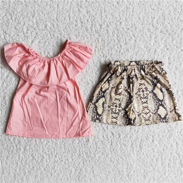 Woven pink top and yellow snake print shorts