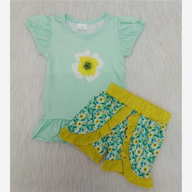 Yellow flowers green blouse plant lace pants