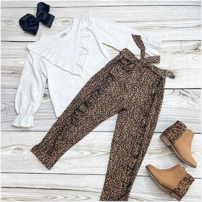 Gray long-sleeved top and leopard-print trousers