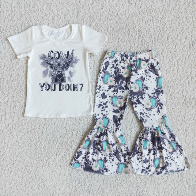 E9-30 cow white short-sleeved cow pattern bell-bottom pants