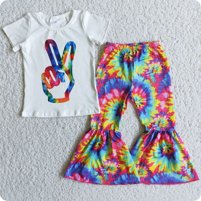 Aa-2 gestures, white top, tie-dye flared pants