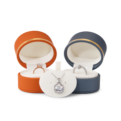 Custom Logo Wholesale New Arrival PU leather jewellery box with golden button ring earrings necklace package oval shape jewelry boxes