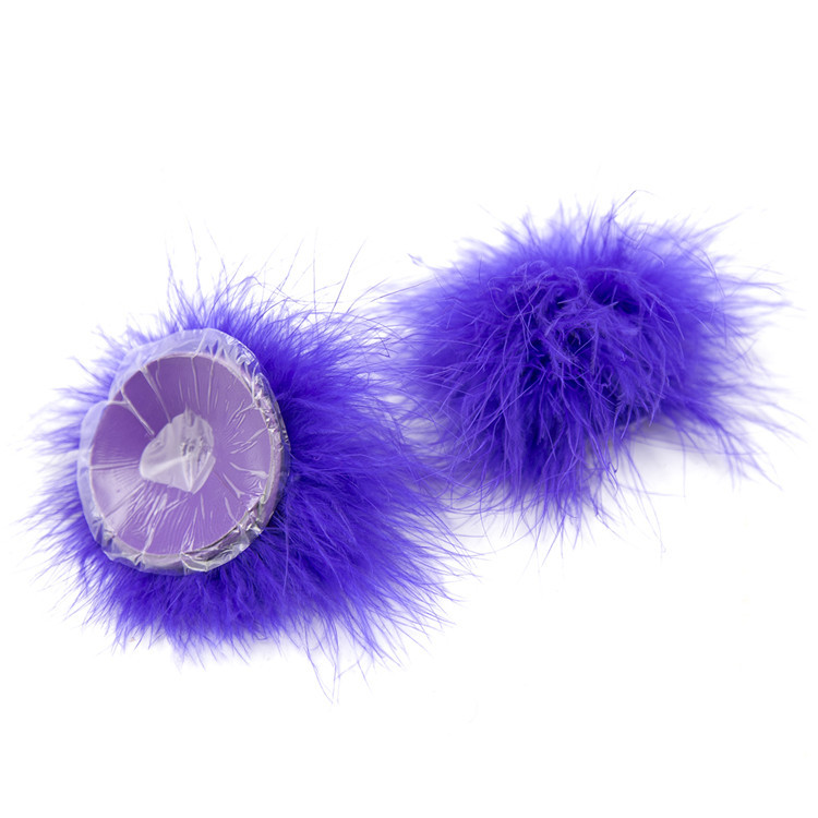 202400061--Feather breast patch, loose shot of adult products, clothing, props, chest patch