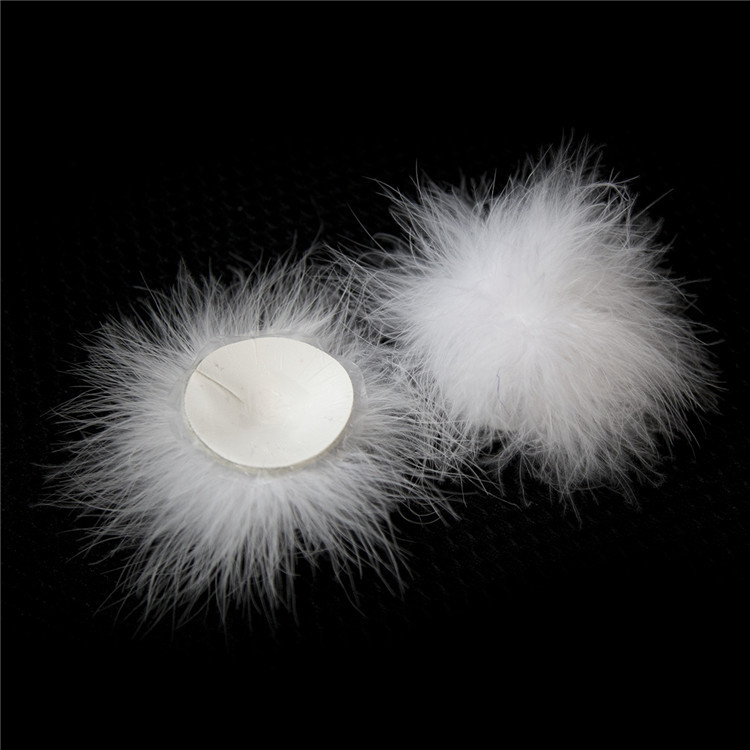 202400061--Feather breast patch, loose shot of adult products, clothing, props, chest patch