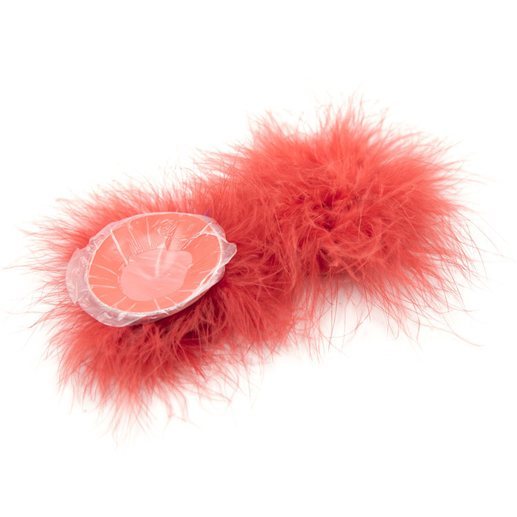 202400061--Feather breast patch, loose shot of adult products, clothing, props, chest patch