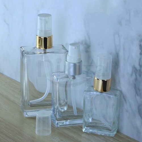 Custom fancy 15ml 30ml 50ml 100ml rectangle clear glass cosmetic serum gold pump bottles with cream pump dispenser