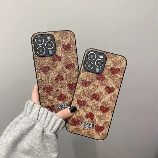 COACH iPhone13Proケース ハート シグネチャー柄