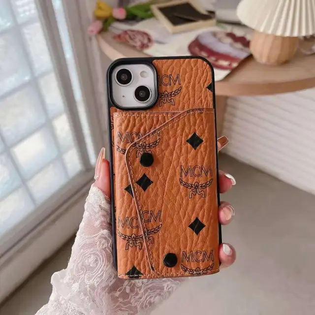 エムシーエム iPhone14カバー ロゴ付き