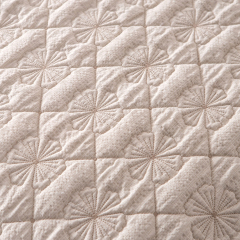 Elegant Embroidered Quilt with Ruffle Edge