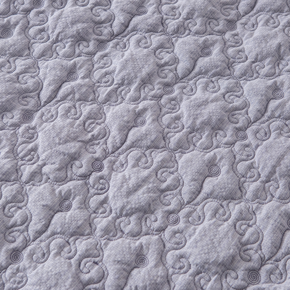 Elegant Embroidered Quilt with Ruffle Edge