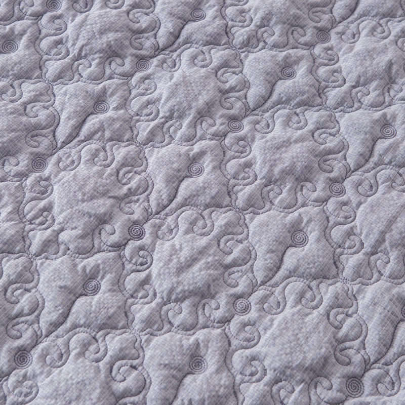 Elegant Embroidered Quilt with Ruffle Edge