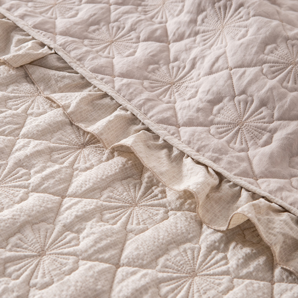 Elegant Embroidered Quilt with Ruffle Edge