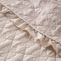 Elegant Embroidered Quilt with Ruffle Edge
