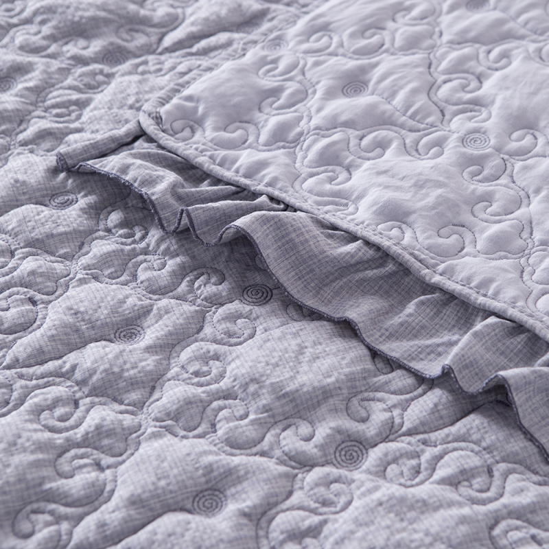 Elegant Embroidered Quilt with Ruffle Edge