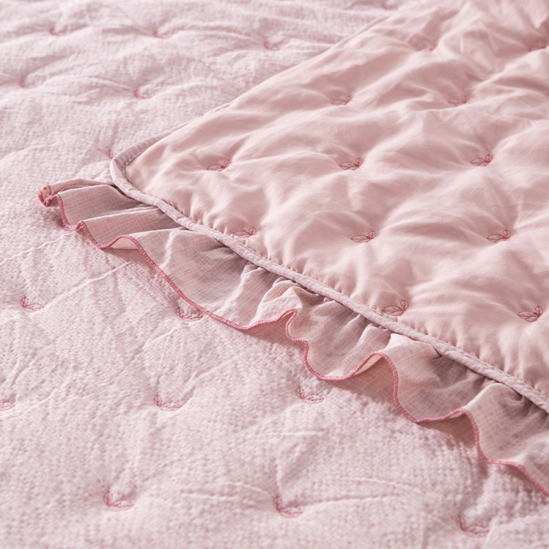 Elegant Embroidered Quilt with Ruffle Edge