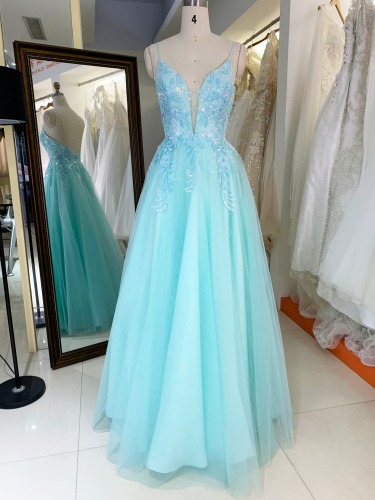 Hand-made beadwork evening gown decorated with tulle lace